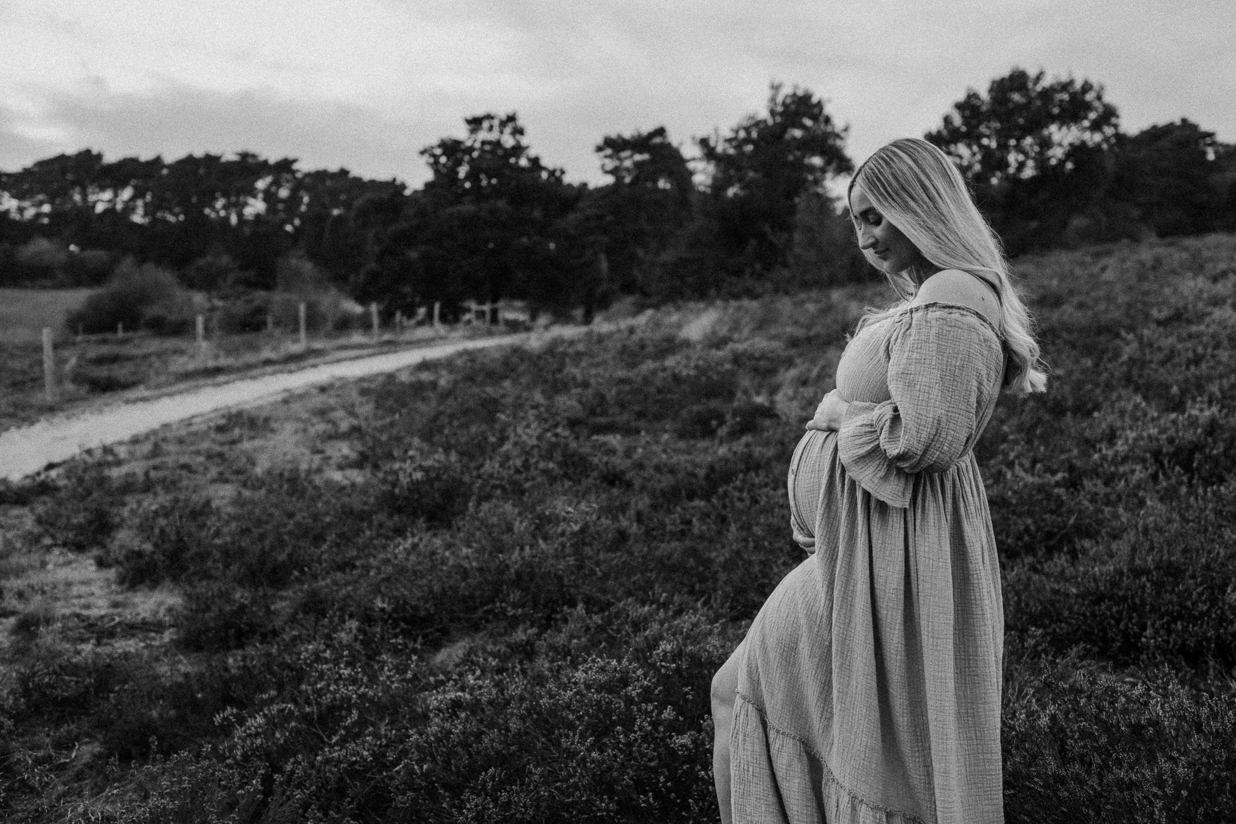 Pregnant woman looking magical and whimsical in the Sussex countryside